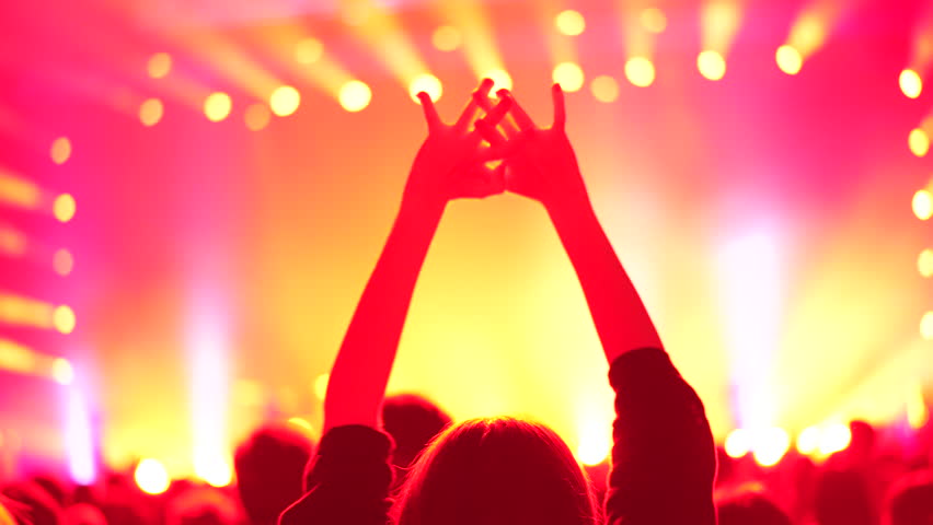 Cheer woman fan hang out. Fun girl enjoy music concert. Epic neon glow light party. Cool dj live show. People clap night club hip hop fest. K pop event applaud. Joy rock roll rave. Teen raise hand up.