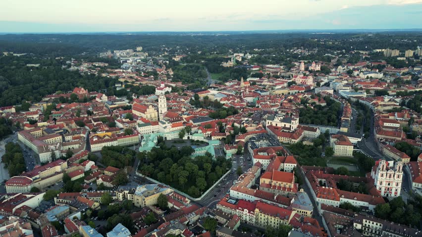 Vilnius cityscape. Beautiful panorama of Vilnius old town After sunset. Uzupis District and Republic in Vilnius, Lithuania. One of the famous district in Vilnius. Drone aerial view Royalty-Free Stock Footage #1108639027