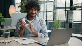 Stressed anxious Arabian Hispanic businessman stress failure at office problem with business papers graphics difficult work trouble mess on desk burnout Indian man crumpling sheet of paper throw away - Powered by Shutterstock - Get 15% off with code: PIKWIZARD15