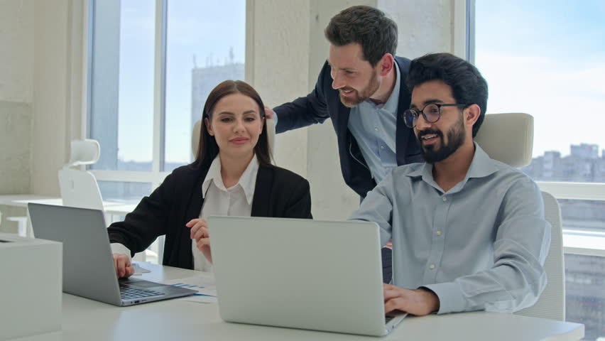 Three happy business people creative team coworkers smiling businessmen businesswoman working together at office company discussing project results mentor teaching office trainees teamwork cooperation Royalty-Free Stock Footage #1108639627