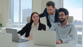 Three happy business people creative team coworkers smiling businessmen businesswoman working together at office company discussing project results mentor teaching office trainees teamwork cooperation - Powered by Shutterstock - Get 15% off with code: PIKWIZARD15