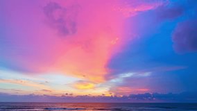 
time lapse colorful reflection of stunning sunset.
beautiful scene with the sun painting the sky above waves 
breaking gently on a sandy
Gradient sweet color. abstract nature background.