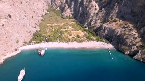 Kelebekler Vadisi, 4k high resolution video of Butterfly Valley in Oludeniz, Fethiye. 4k drone view from above of turquoise beautiful sea and bay. This sea known as in turkish 