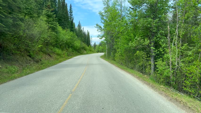 Driving along Miette Hot Springs Road in Jasper National Park near Jasper, AB Canada.