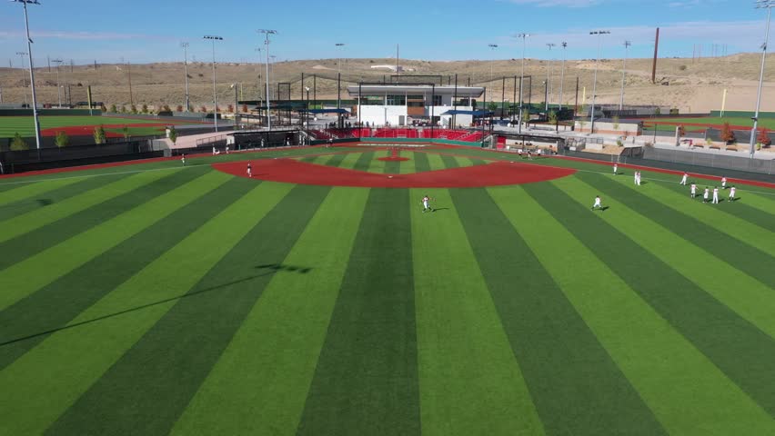 
Baseball field with warm up players in Albuquerque New Mexico