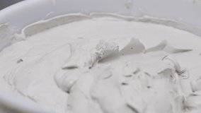 Plaster compound basket mixing material, for drywall finish, before painting, home improvement theme. - Powered by Shutterstock - Get 15% off with code: PIKWIZARD15