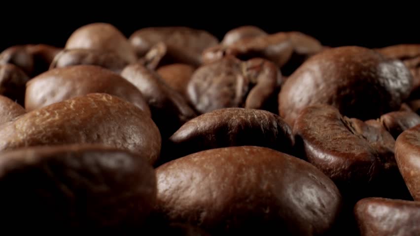Coffee bean close-up. Roasted coffee beans slow motion. Royalty-Free Stock Footage #1108662369