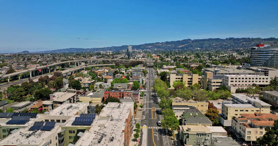 Oakland California Aerial v10 flyover across pill hill and mosswood neighborhoods, flying straight above telegraph avenue capturing complex interstate highways - Shot with Mavic 3 Cine - April 2022 Royalty-Free Stock Footage #1108662719
