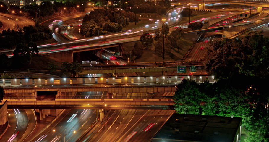 Atlanta Georgia Aerial v884 hyperlapse drone flyover busy interstate freeway capturing speed up traffic trails and night cityscape across Midtown and downtown - Shot with Mavic 3 Pro Cine - May 2023
