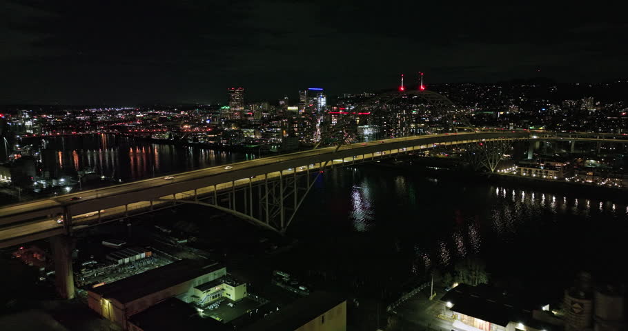 Portland Oregon Aerial v112 flyover Willamette River and Fremont bridge towards Pearl District along NW 10th Avenue capturing lively downtown cityscape at night - Shot with Mavic 3 Cine - August 2022 Royalty-Free Stock Footage #1108662815