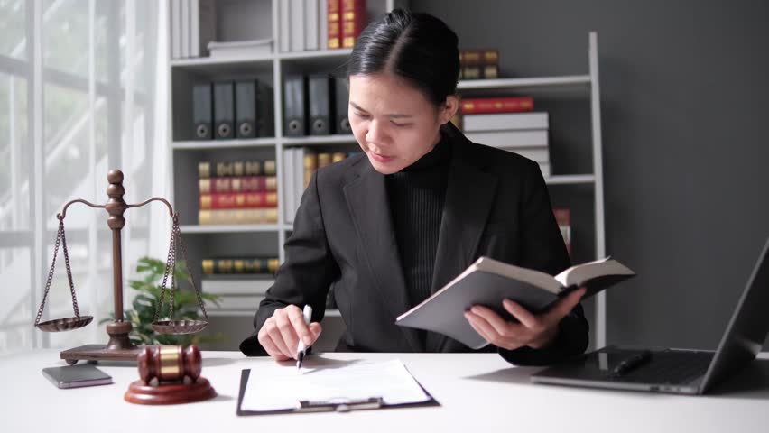 lawyer working with contract papers and wooden gavel on tabel in courtroom. justice and law ,attorney, court judge, concept. Royalty-Free Stock Footage #1108667455