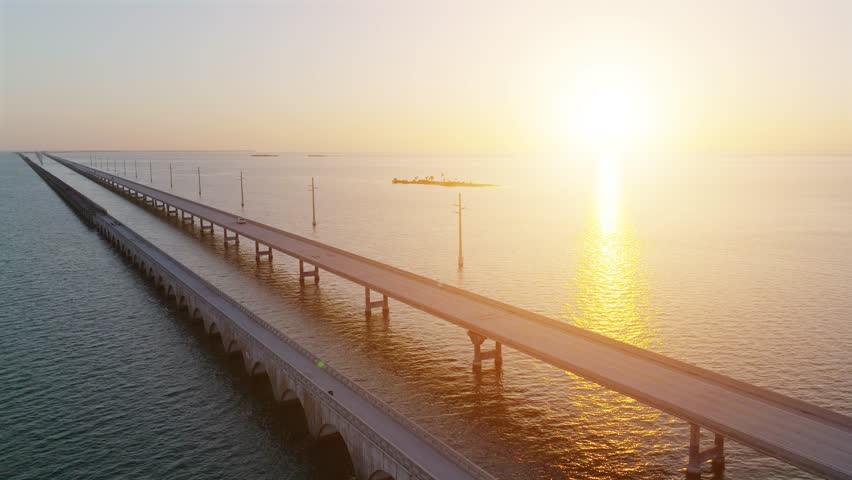 Aerial shot of the Seven Mile Bridge in Florida at sunrise. The bridge connects the Florida Keys on the way to Key West. Royalty-Free Stock Footage #1108670061
