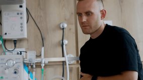 Concerned Caucasian man walking by the delivery room. Husband worries for his wife giving childbirth. - Powered by Shutterstock - Get 15% off with code: PIKWIZARD15