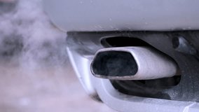Smoke from the exhaust pipe of a car. - Powered by Shutterstock - Get 15% off with code: PIKWIZARD15
