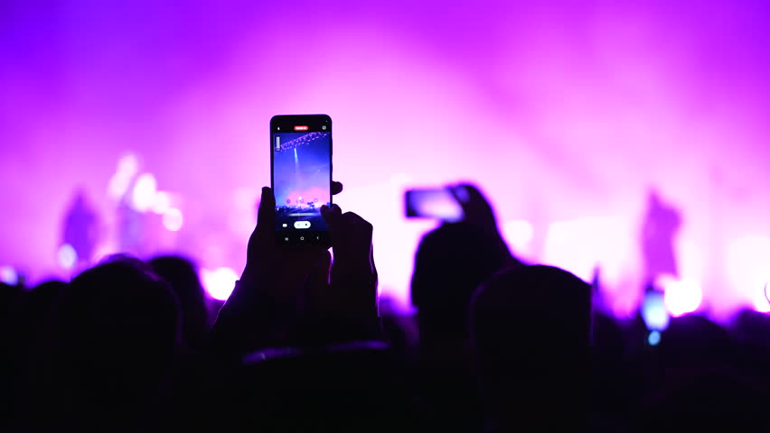Lot fun people record music video use mobile phone. Fan crowd shoot k pop live concert. Many men hang out cool rave fest. Joy group chill night club hall. Dj star raise hand up. Make neon light photo. Royalty-Free Stock Footage #1108679715