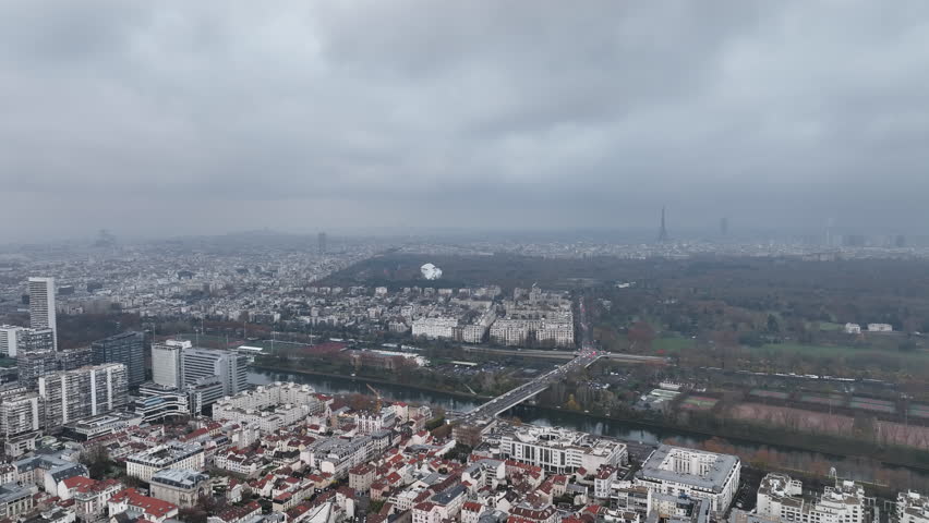 La Défense, Paris's business heart, shrouded in a cloudy embrace.
 Royalty-Free Stock Footage #1108680463