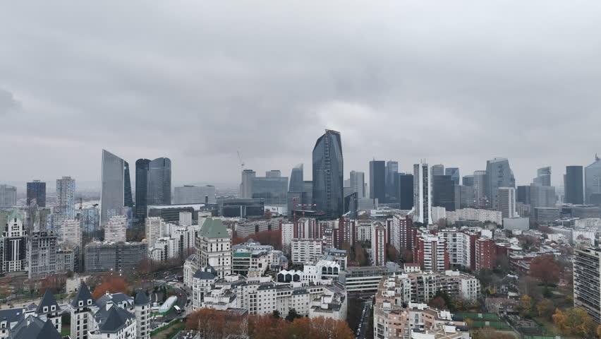 Paris's financial district, La Défense, stretches out beneath the overcast.
 Royalty-Free Stock Footage #1108680467