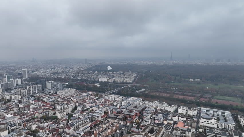 The city's modern skyline in La Défense seen from a cloudy altitude.
 Royalty-Free Stock Footage #1108680471