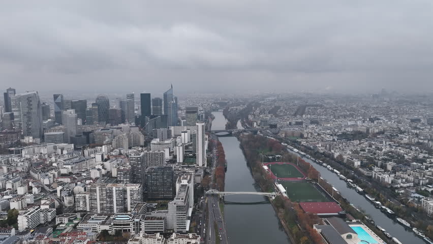 Aerial view of La Défense, Paris's modern hub, under a cloudy sky.
 Royalty-Free Stock Footage #1108680473
