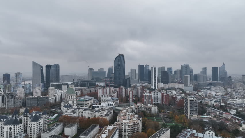 Aerial perspective captures the energy of La Défense under clouds.
 Royalty-Free Stock Footage #1108680475