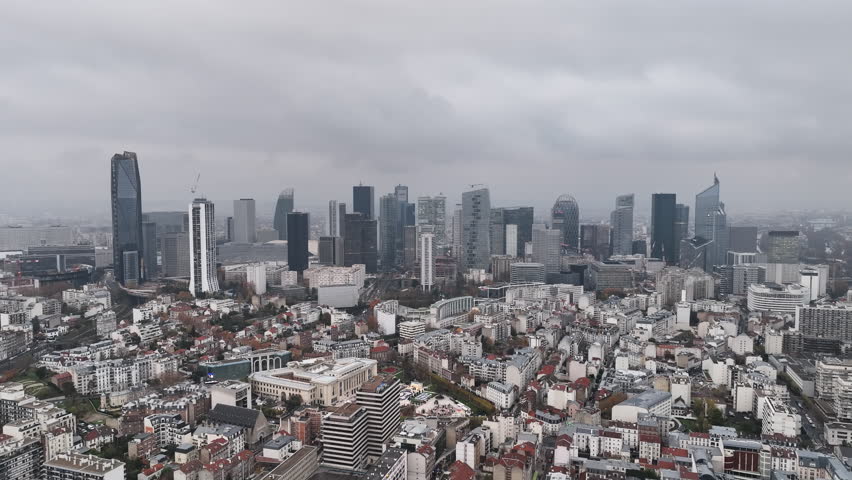 A cloudy aerial vista reveals the architectural beauty of La Défense.
 Royalty-Free Stock Footage #1108680479
