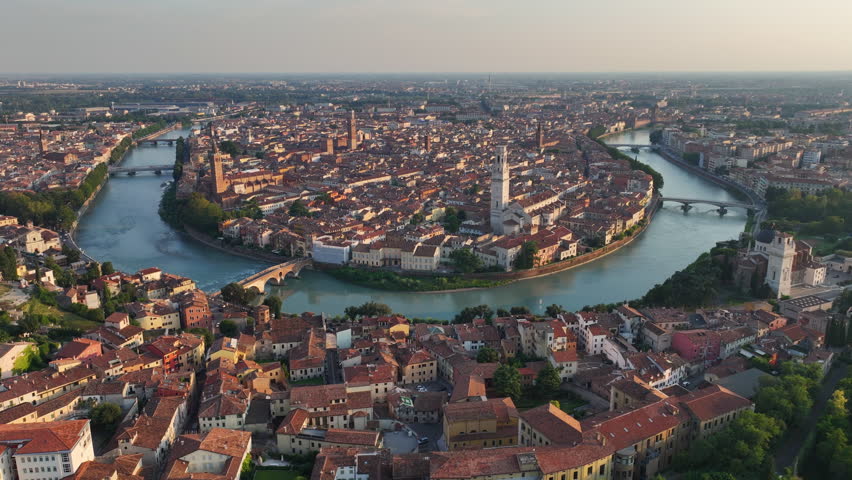 Bird's Eye View of Verona city skyline, Ponte Pietra, Adige River, Historic City Centre, Duomo Cathedral and Iconic Red Roofs, Veneto Region, Italy Royalty-Free Stock Footage #1108681251