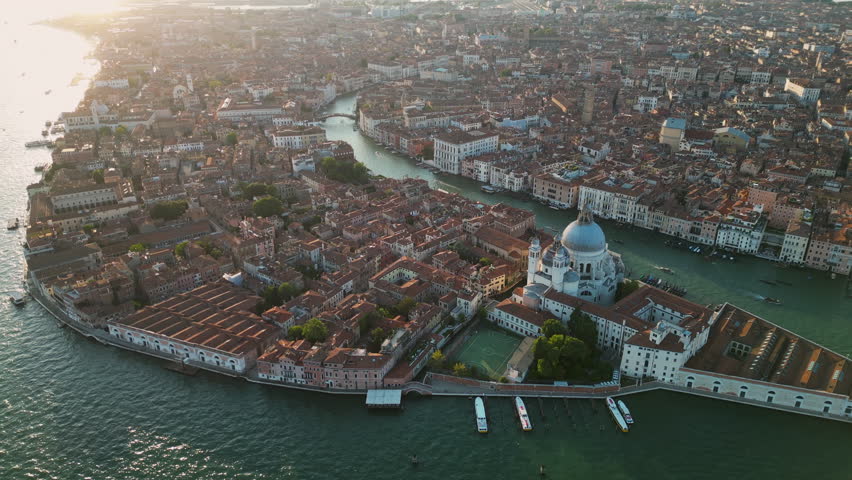 Venice city skyline, aerial view of Basilica di Santa Maria della Salute and Grand Canal, triangular shape architecture, Venetian Lagoon, Italy Royalty-Free Stock Footage #1108681275