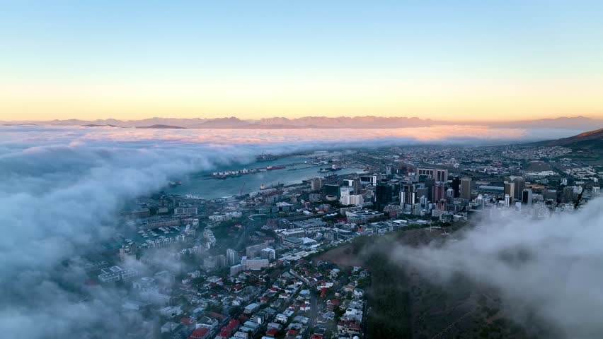 Aerial view of Cape Town residential district with low clouds fog from Signal Hill, Cape Town, South Africa. Royalty-Free Stock Footage #1108682117