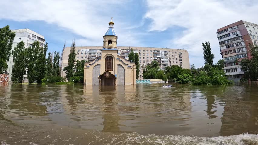 Flooded church in Kherson as a result of the explosion of a dam on the Dnipro river in city of Novaya Kakhovka. Consequences of the detonation of Kakhovka Hydroelectric Power Station. War in Ukraine. Royalty-Free Stock Footage #1108684391