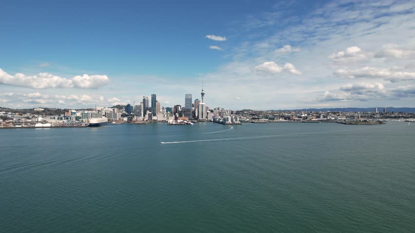 Aerial shot of Auckland CBD and Sky Tower with the Waitemata Harbour 4k