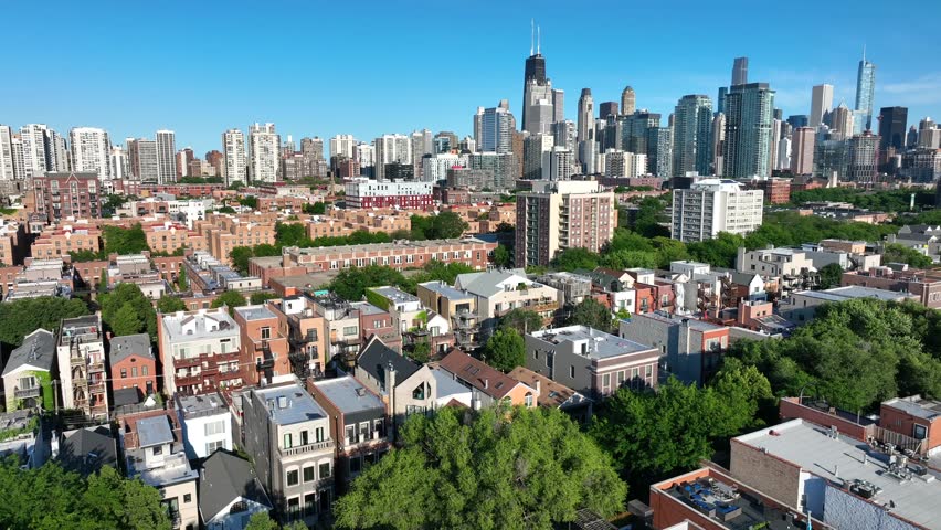 Residential neighborhood in downtown Chicago, Illinois in summer. Aerial descending shot of condos, houses, homes, and apartments.