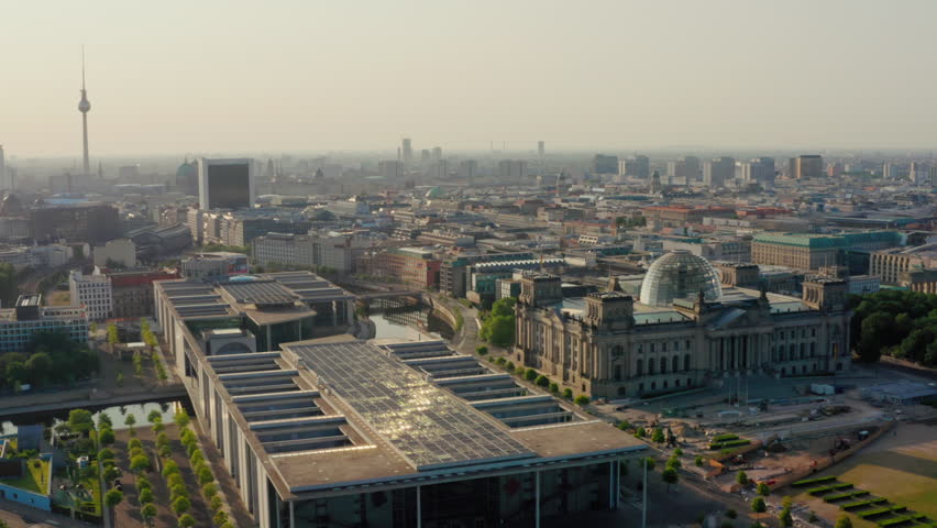 Establishing Aerial shot of Berlin Downtown with Reichstag and German Federal Chancellery. Bundestag Government Buildings and TV Tower as European Political Landmarks. Scenic 4K drone cityscape