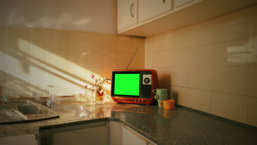 Vintage Television Green Screen Kitchen Table Retro TV Zoom In. Old television with green screen on the kitchen table of a vintage house. Zoom in Royalty-Free Stock Footage #1108698065