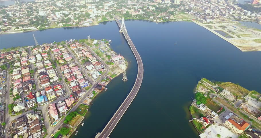 The Lekki-Ikoyi Link toll bridge in Lagos, Nigeria - high altitude aerial reveal Royalty-Free Stock Footage #1108700203