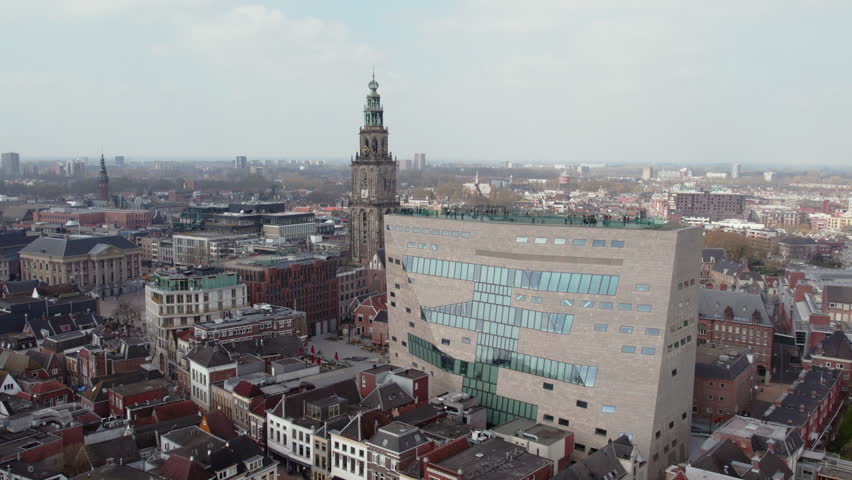 Forum Groningen Cultural Center With Martinitoren At Background In The City Center Of Groningen, Netherlands. Aerial Sideways Shot Royalty-Free Stock Footage #1108700211