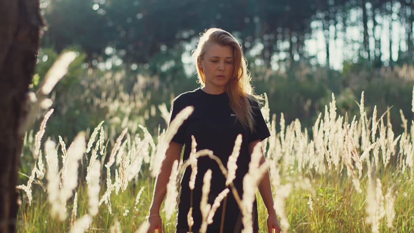 Woman stretching and warming-up after running in nature enviroment, athlete sport recreation post-workout recovery