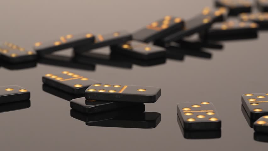 Falling Glossy Black Dominoes on a glass table