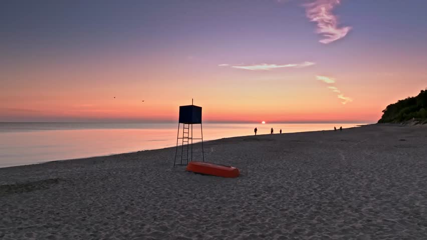 Sunriseat lifeguard hut and boat on beach by Sea, Poland, Poland Royalty-Free Stock Footage #1108718495