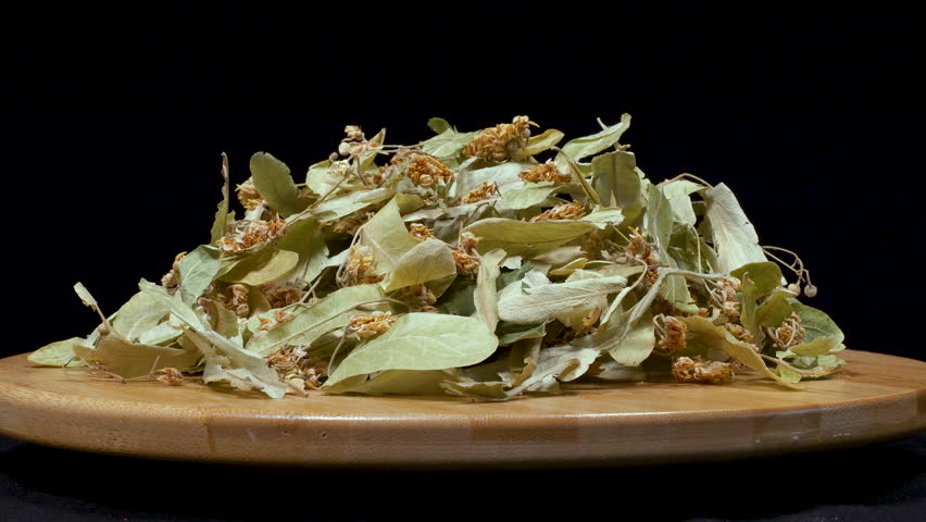 Close-up footage of dried linden flowers on black background. Royalty-Free Stock Footage #1108719497