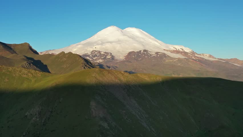 Aerial view of Mount Elbrus at sunrise, North Caucasus mountains, Russia, 4k