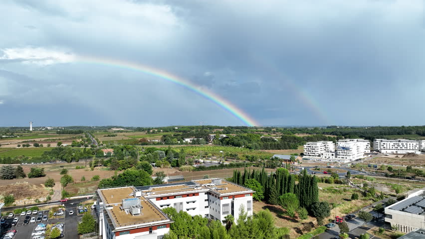 Aerial Montpellier: Vineyards, cloudy Mediterranean horizons, and the occasional burst of rainbow colors.

