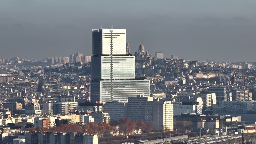 City skyline of Paris aerial view Montmartre in background aerial shot polluted sky