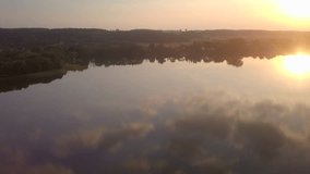 Beautiful masurian lake at sunset. Polish landscape - aerial video.
