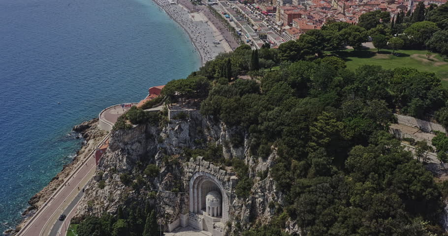 Nice France Aerial v18 birds eye view drone fly around castle hill capturing rauba capeu memorial, scenic artificial waterfall and hilltop historic jewish and catholic cemetery - July 2021