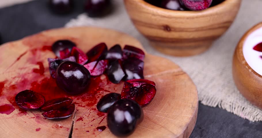 Cut ripe sweet cherry berry of red color, delicious and ripe cherry berries during dessert preparation | Shutterstock HD Video #1108734991