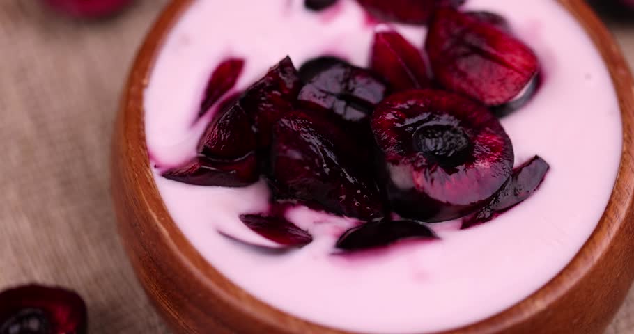 Fresh cow's milk yogurt with cherry berries, dairy products yogurt with taste and pieces of fresh cherry berries | Shutterstock HD Video #1108734997