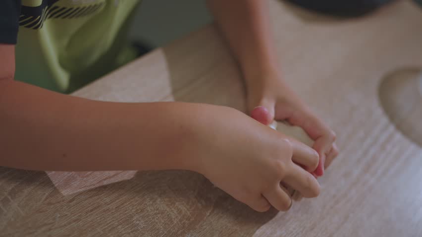 Therapeutic plasticine, therapeutic expander, child on the procedure of ergotherapy, ergotherapy, rehabilitation after injury, rehabilitation center | Shutterstock HD Video #1108736337
