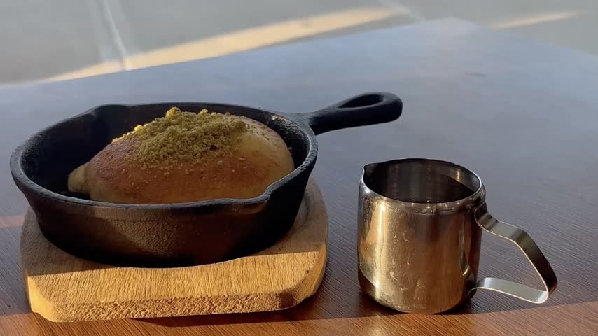 Knafeh, the beloved Middle Eastern dessert that's a symphony of textures and flavors. Watch as layers of crisp, golden pastry are skillfully crafted, revealing a luscious and creamy cheese center.