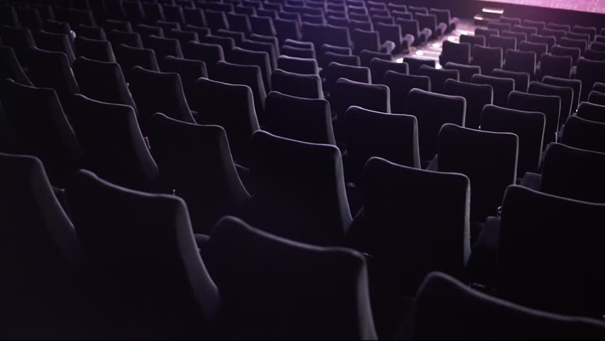 Empty seats in a movie theater - no people in the cinema during the movie performance - stock photography Royalty-Free Stock Footage #1108741435