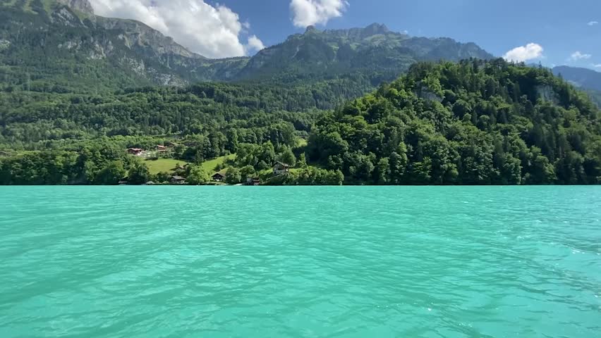 Driving along the coast of Haiti with forests on the mountains